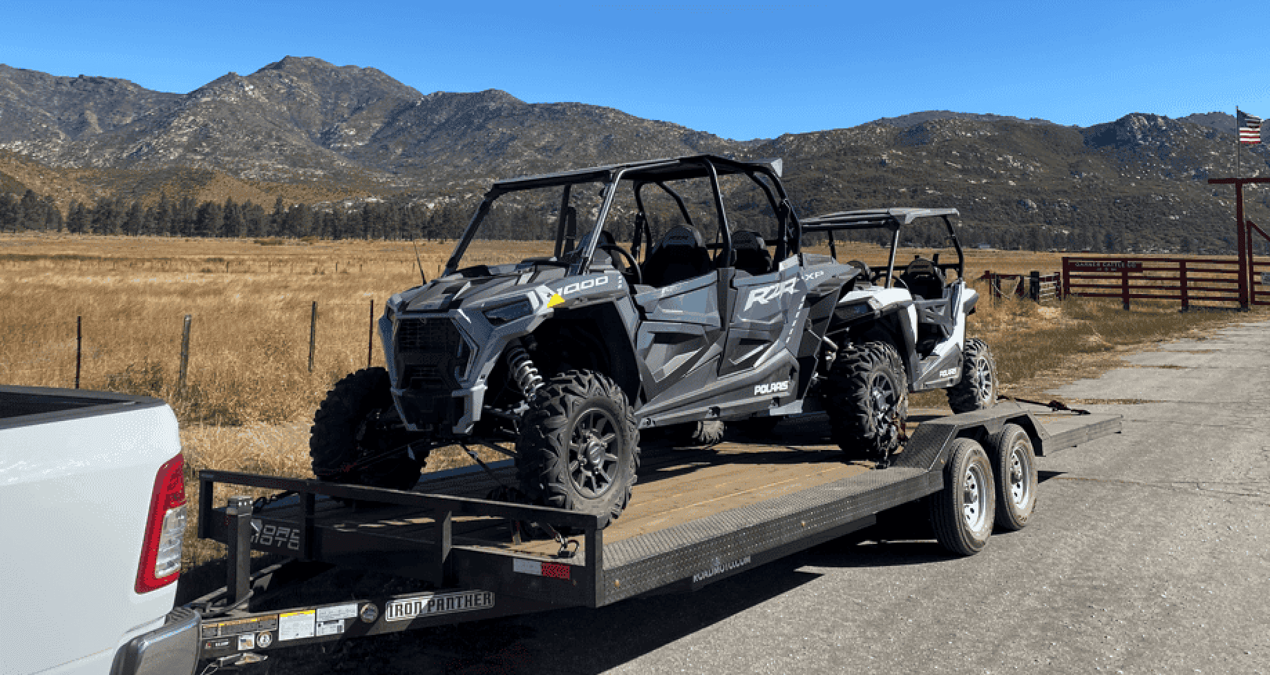 ROADMOTO flatbed trailer rental loaded with Polaris RZR UTVs in Los Angeles