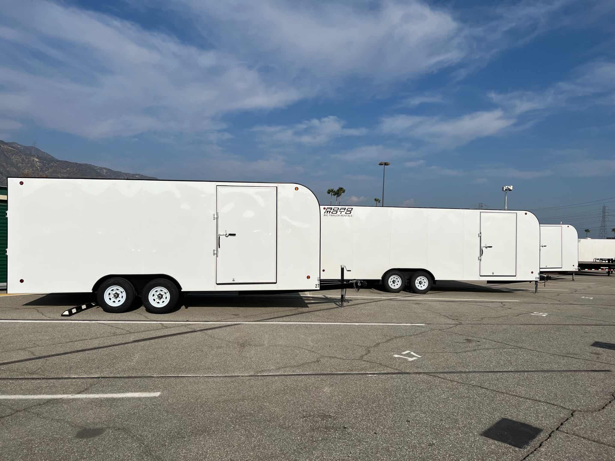 Fleet of white ROADMOTO enclosed trailers available for rent in Azusa California
